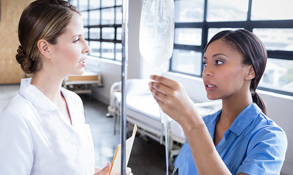 A nurse and a nursing student on the ward, having a difficult conversation