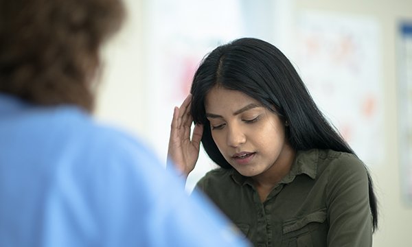 What symptoms should nurses be advising patients to look out for?