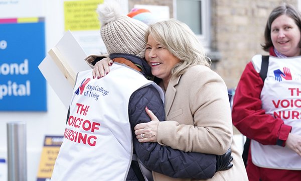 RCN general secretary Pat Cullen hugs a worker on the picket line outside Great Ormond Street Hospital in London on 6 February
