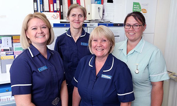 (L-R) Emma Williamson with practice nurses Maureen McCarthy and Sharon Marshall, and healthcare assistant Victoria Larkman. Ms Williamson devised a pathway for her practice’s leg ulcer care that improved healing, cut spending and freed nurses’ time.