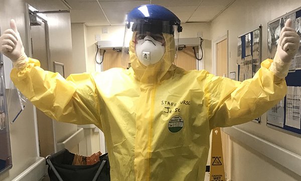 Newly qualified nurse Jesse Boxall-Steeden in full PPE in a critical care unit