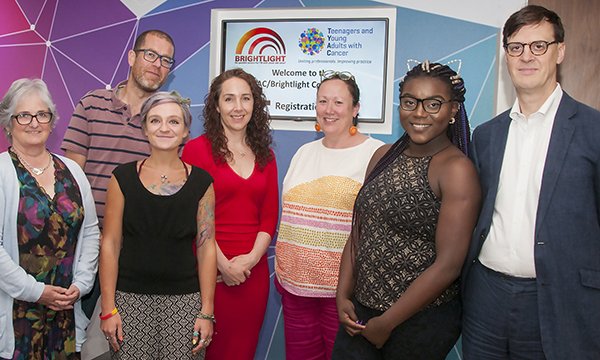 Picture shows Maria Onasanya (second right) and Rachel Taylor (third right) with researchers from the Brightlight study on cancer in young people and a patient representative.