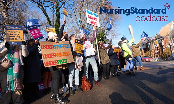 Nurses holding placards and dressed for the cold weather, picket Northern General Hospital in Sheffield