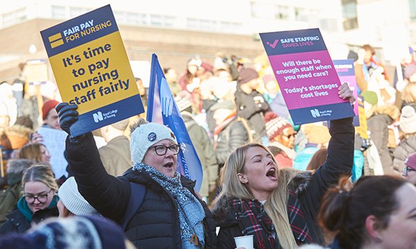 Nurses hold placards on picket line in Sheffield during NHS pay strike